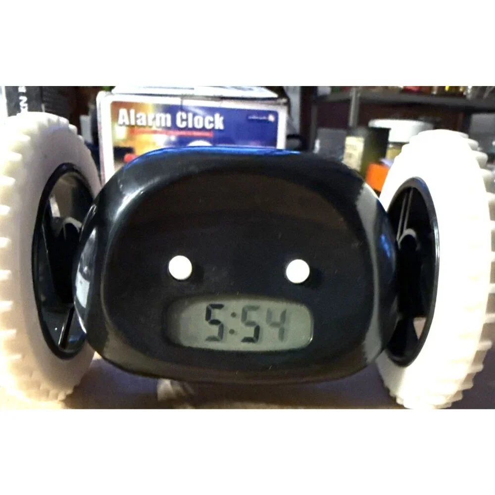 Alarm Clock on Wheels Black Runaway Lights Sounds Snooze - Picture 1 of 10